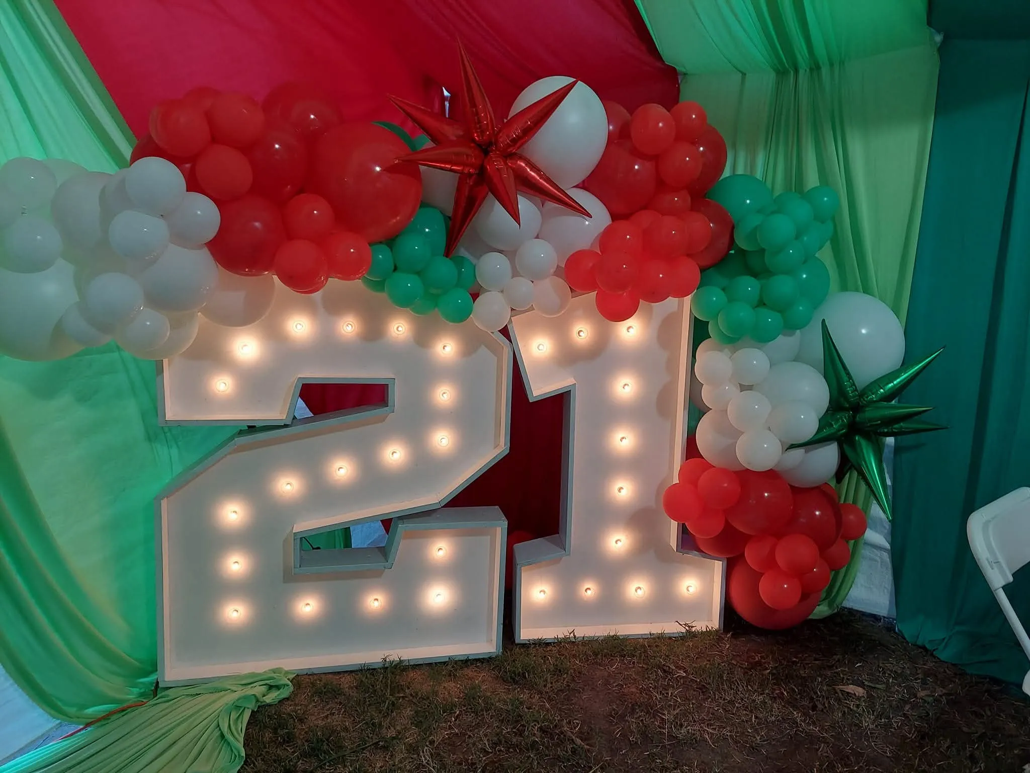 21st birthday green, red, and white balloon decoration