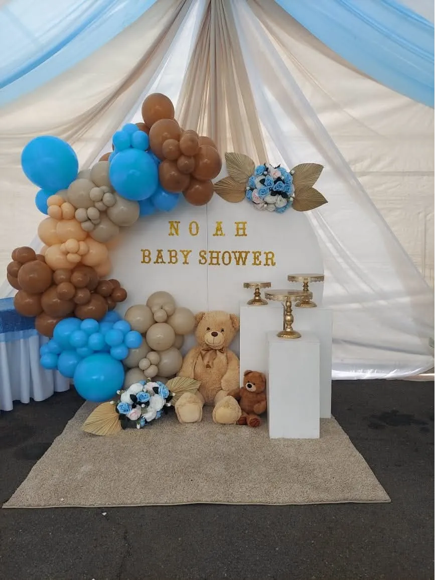Baby shower blue and brown balloon backdrop with teddy bear